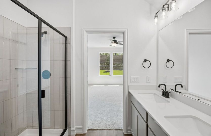 Primary bath with beautiful tile surrounded shower