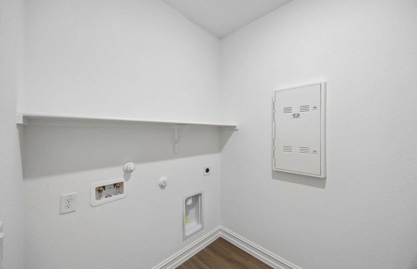 Laundry room with built-in shelving