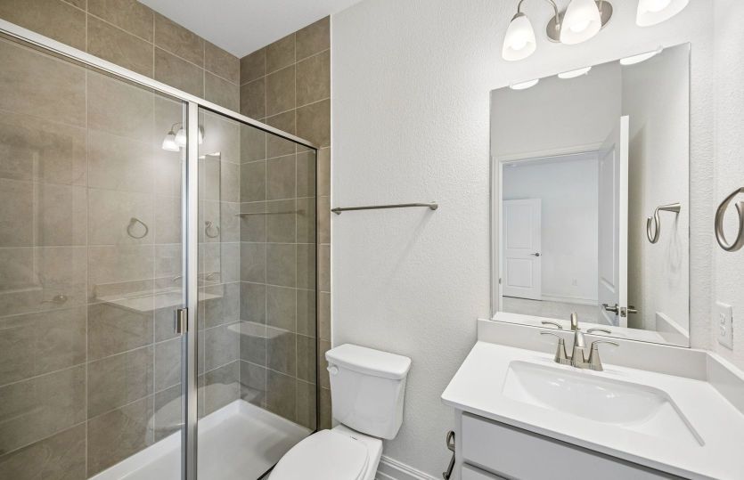 Secondary bath with tile surrounded shower