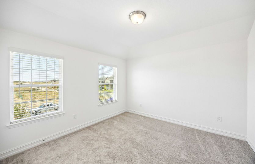 Secondary bedroom with large windows