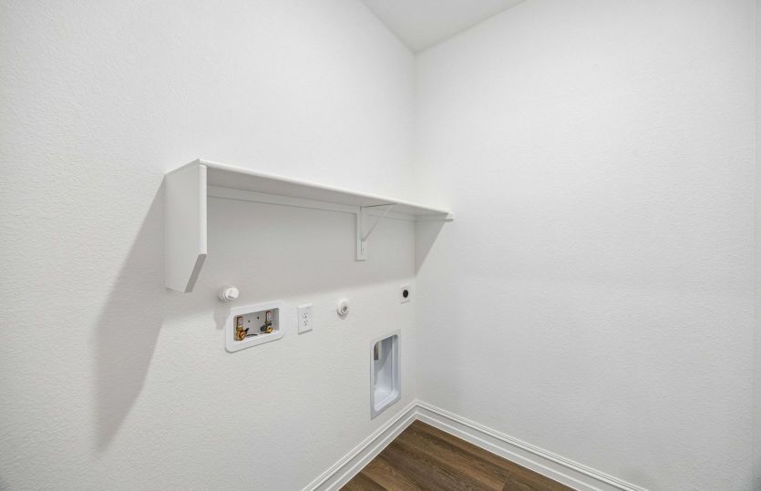 Laundry room with built in shelving