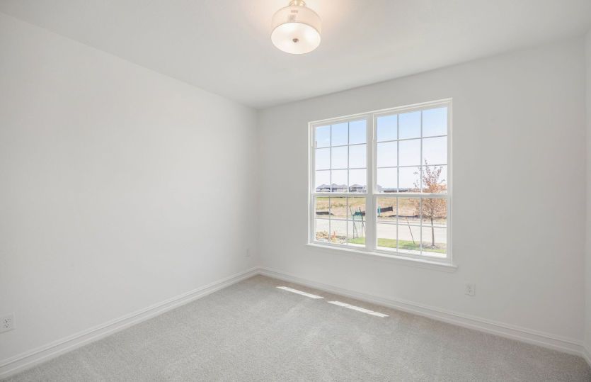 Secondary bedroom with large window