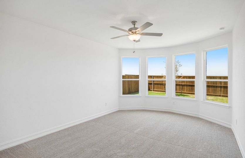 Primary bedroom with bay windows