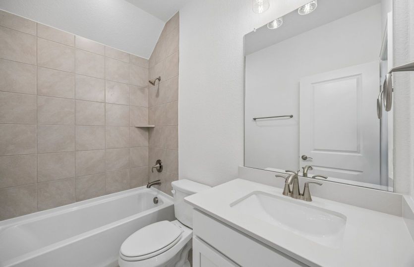 Secondary bath with tile surrounded shower