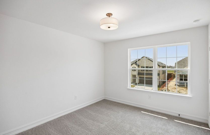 Secondary bedroom with large windows