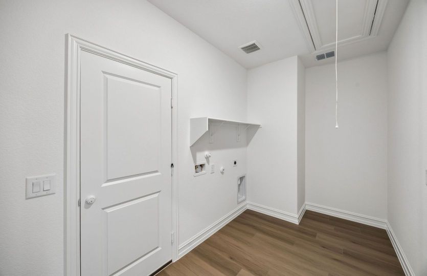 Laundry room with built-in shelving