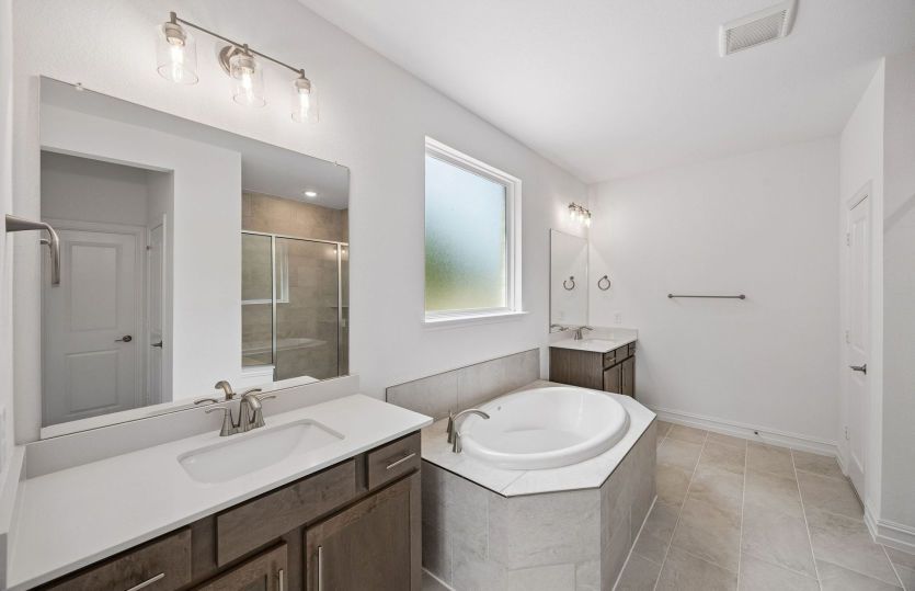 Owners private bath with double vanity