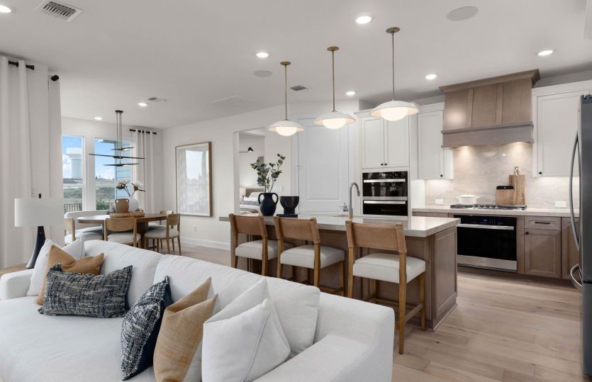 View of eat-in island kitchen  *photos depict some features that may change