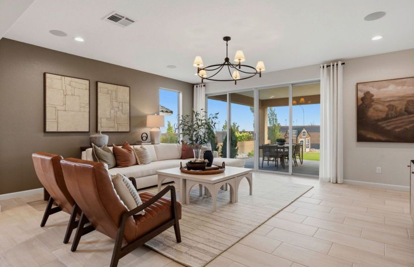 Enjoy a brightly lit gathering room thanks to the large window and backyard sliding glass door.