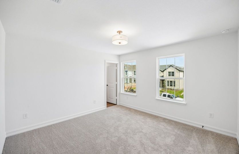 Secondary bedroom with large windows