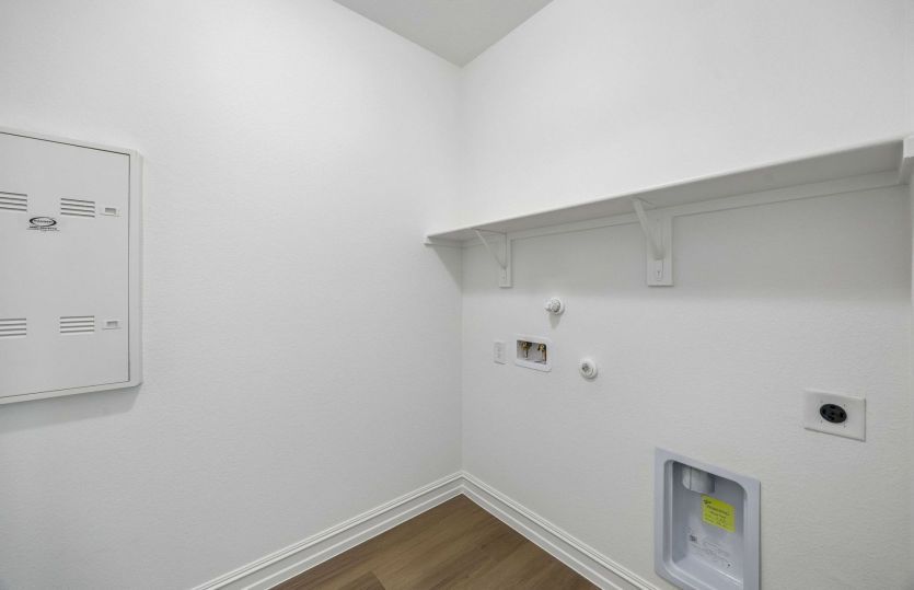 Laundry room with built-in shelving