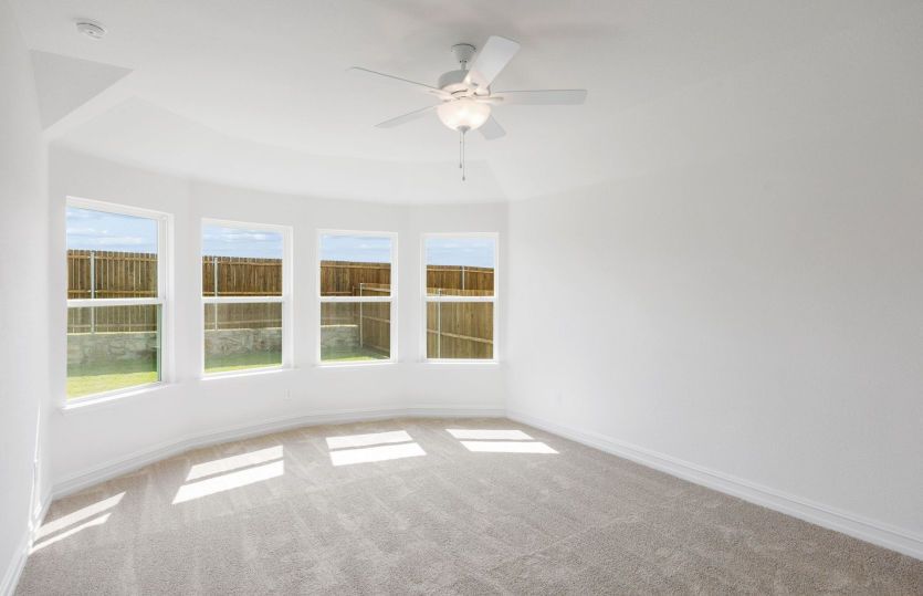 Primary bedroom with large windows