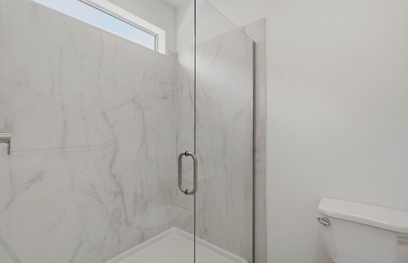 Frameless glass shower gives bathroom a sleek and modern look