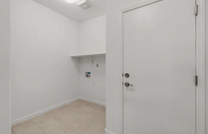 Functional laundry room with built-in storage