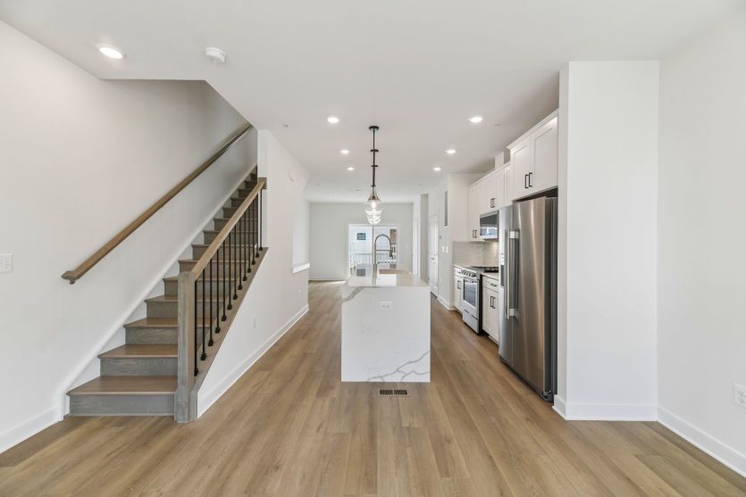 Café Opens to Kitchen and Gathering Room - Actual Home