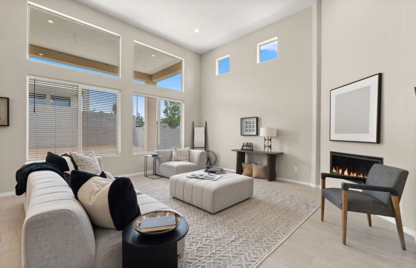 Oversized windows and high ceilings make the room feel even larger