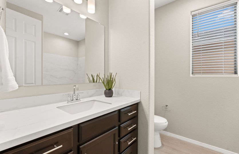Guest bathroom with ample storage and counter space