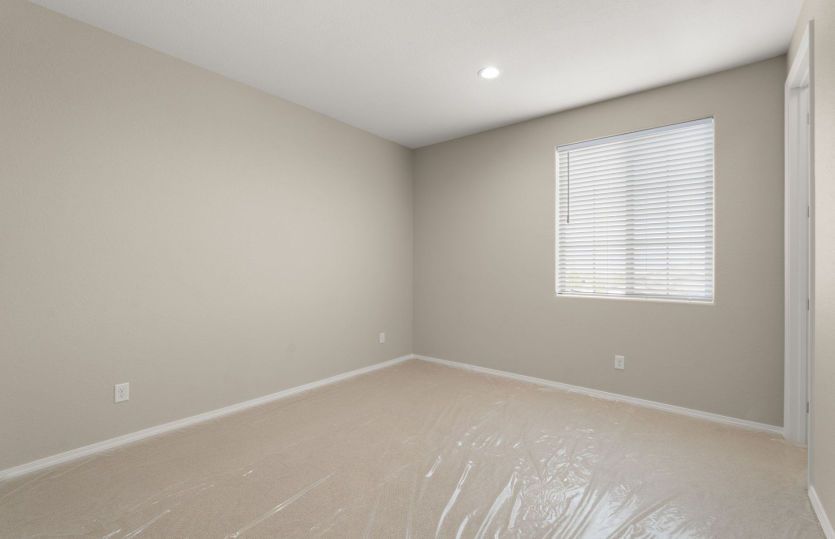 Third upstairs bedroom with large window for ample natural light