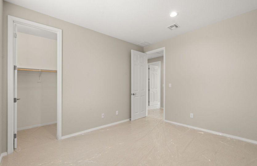Third upstairs bedroom with large window for ample natural light