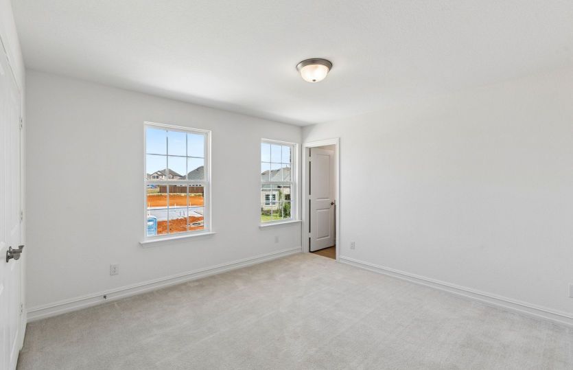 Secondary bedroom with large windows