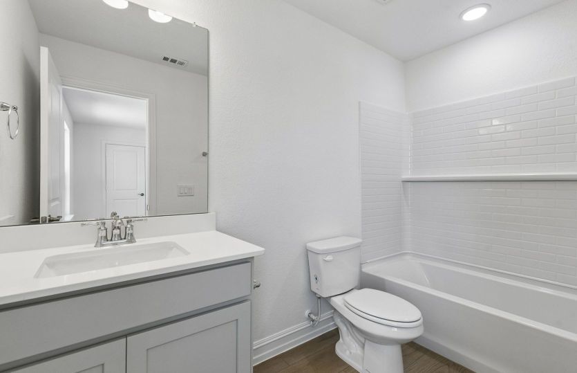 Secondary bath with tile surrounded shower