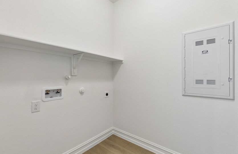 Laundry room with built-in shelving