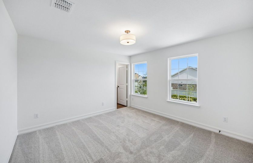 Large windows in secondary bedroom