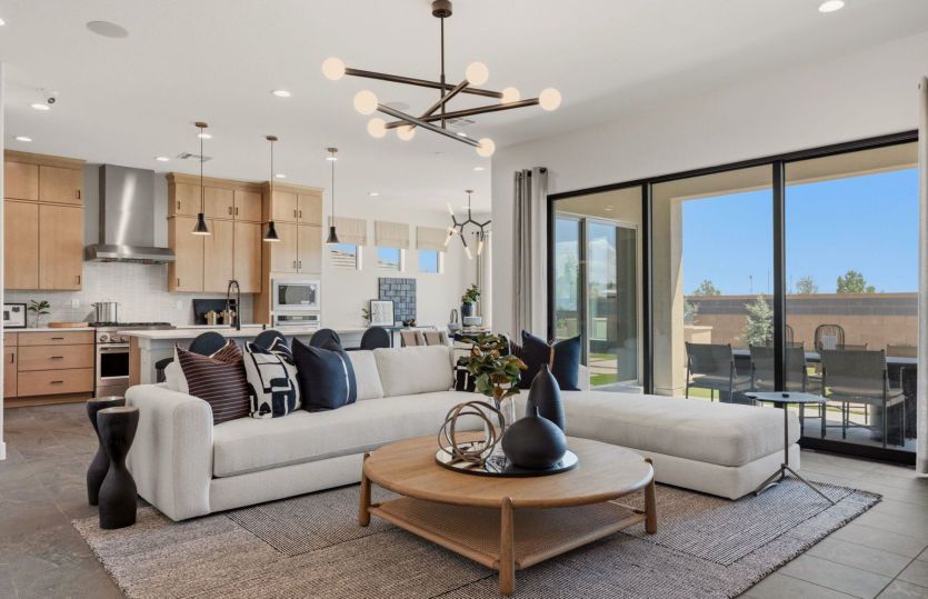 Spacious interior gathering room and kitchen plus gorgeous dining room.