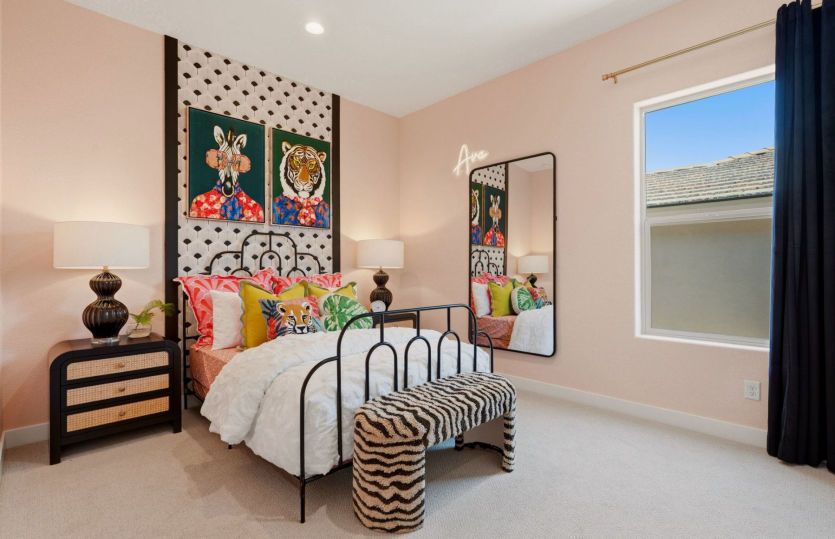 Bedroom 2 includes a bright window, carpet, and it's own closet.