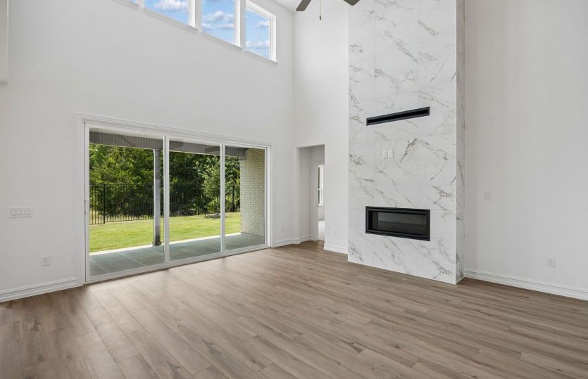 Two-story ceilings with beautiful optional fireplace