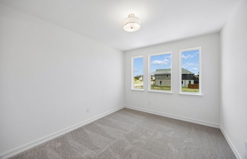 Secondary bedroom with large windows