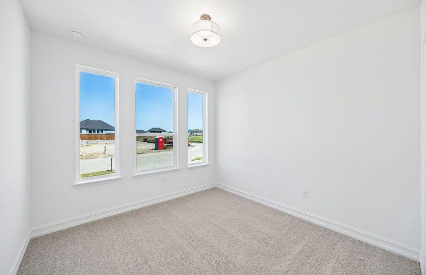 Secondary bedroom with large windows