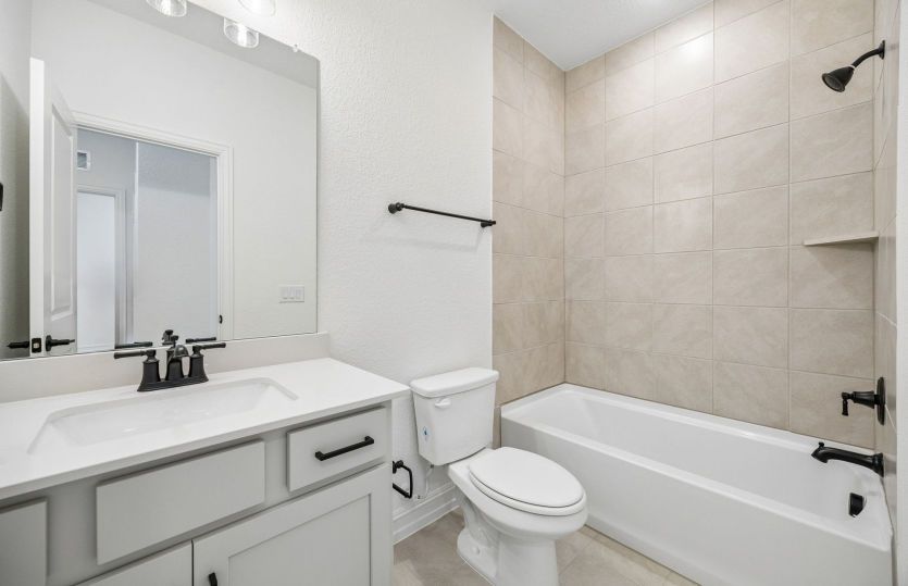 Secondary bath with tile surrounded shower