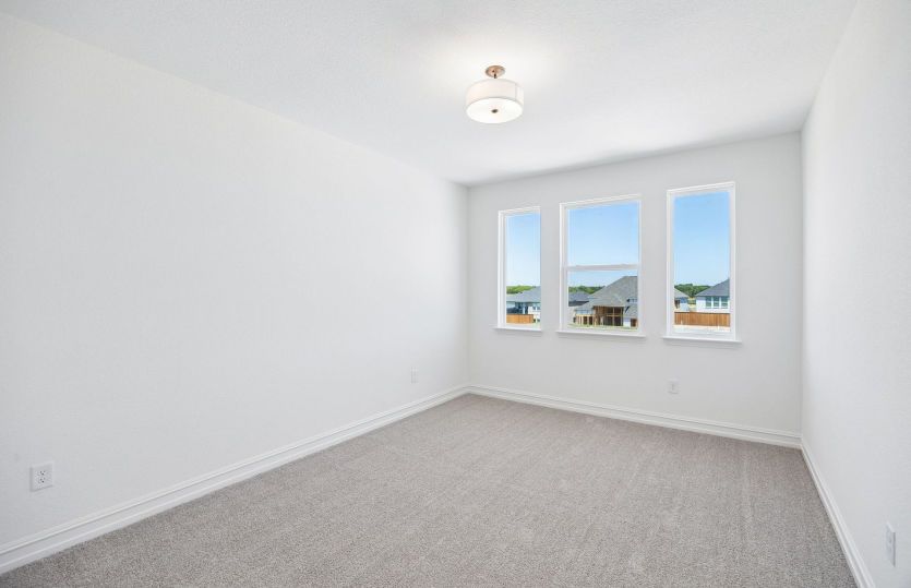 Secondary bedroom with large windows