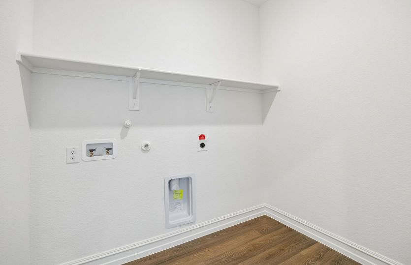Laundry room with built-in shelving