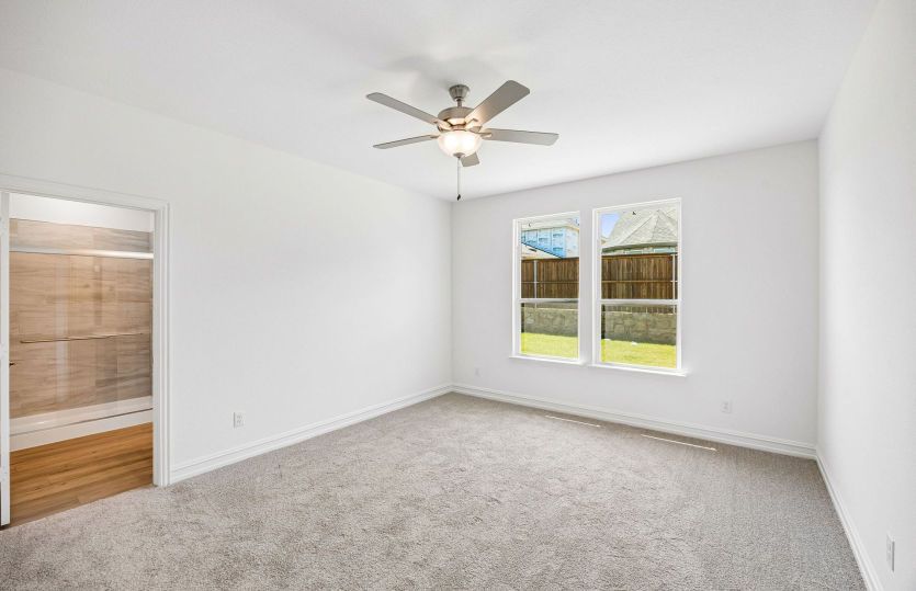 Primary bedroom with large window