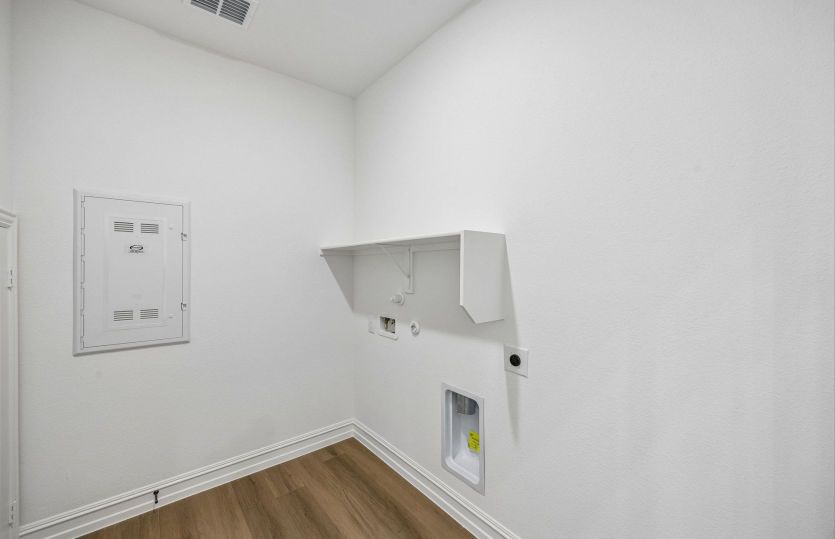 Laundry room with built-in shelving