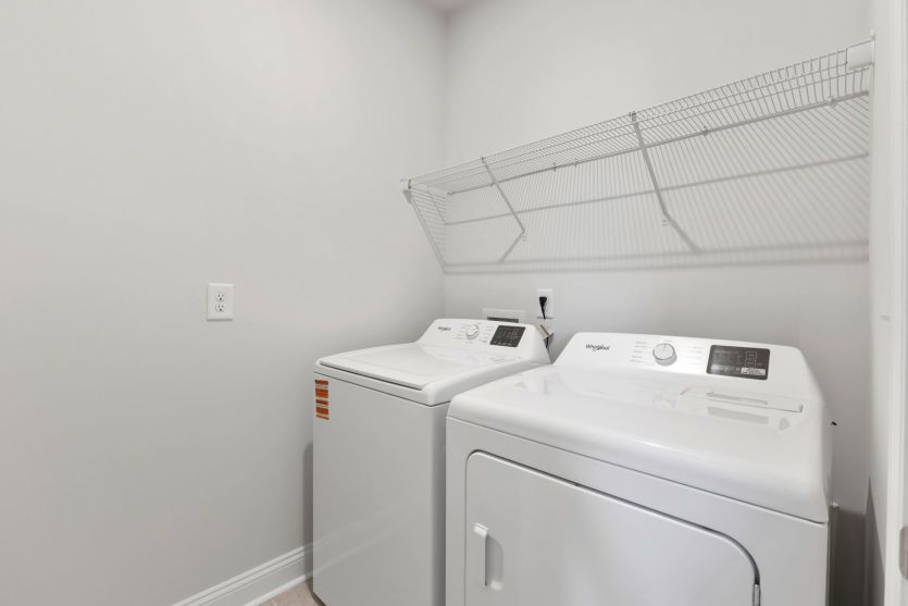 Convenient laundry room with functional storage.