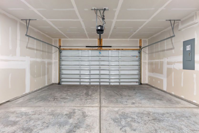 Spacious garage with convenient home storage.