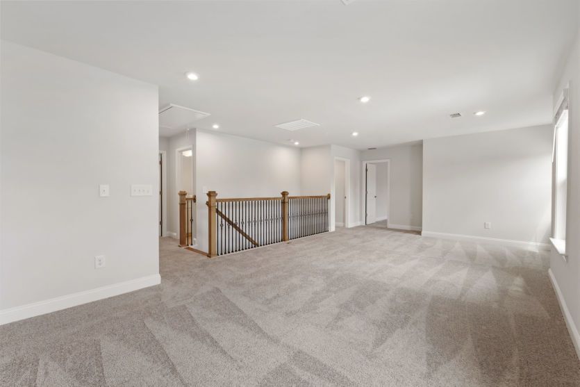 Versatile loft space for relaxing and recreation.