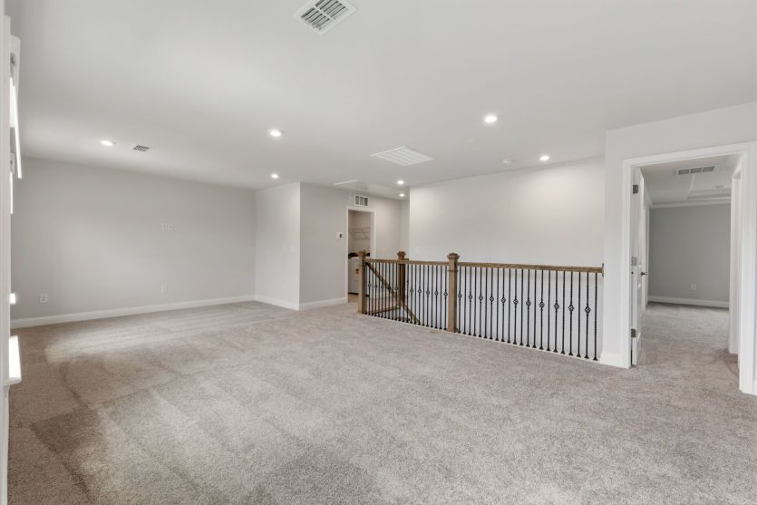 Versatile loft space for relaxing and recreation.