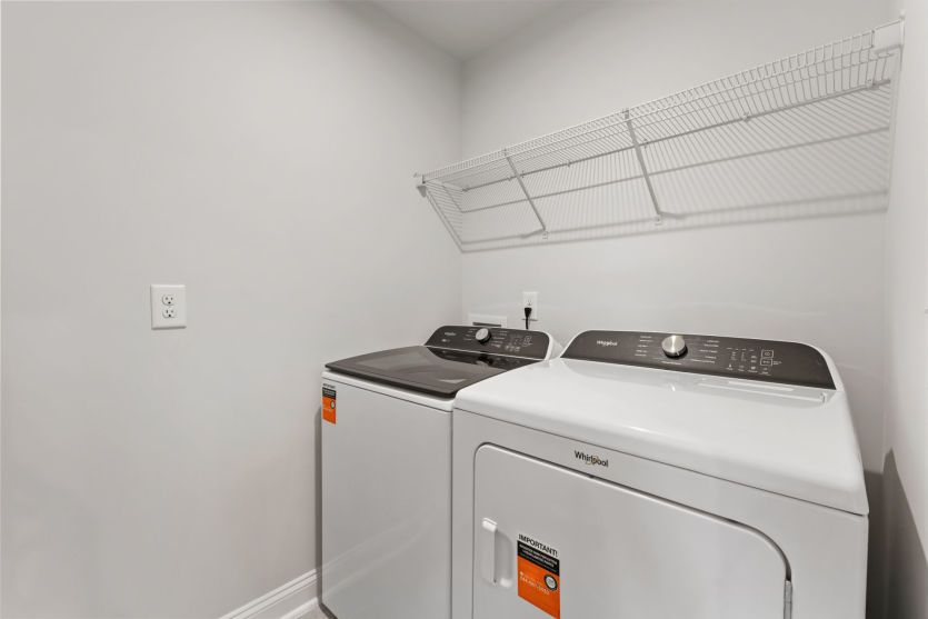 Convenient laundry room with functional storage.