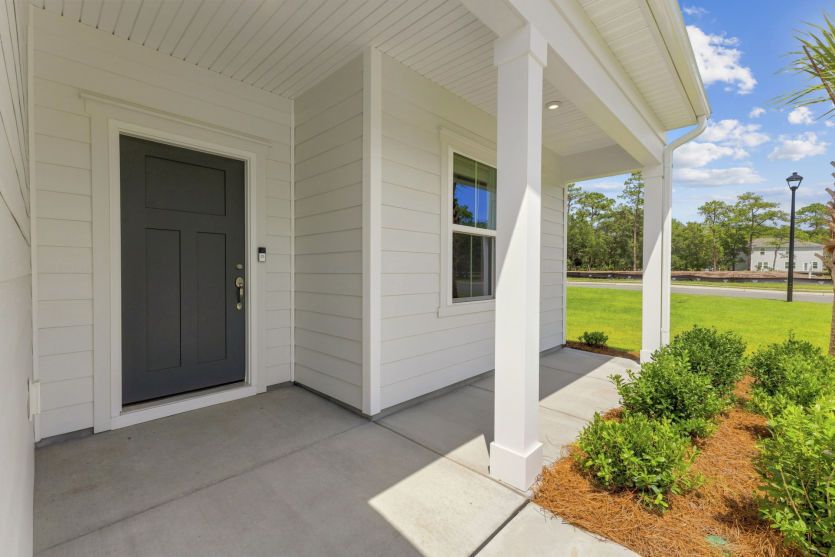 Charming front porch with welcoming curb appeal.