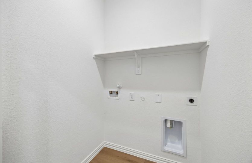 Laundry room with built-in shelving