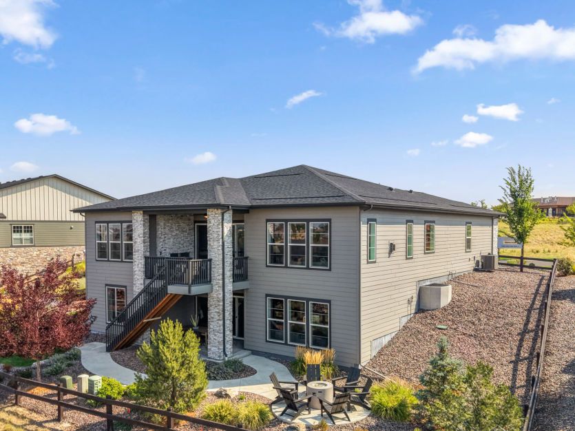 Back Exterior with Fire Pit, Covered Deck and Patio
