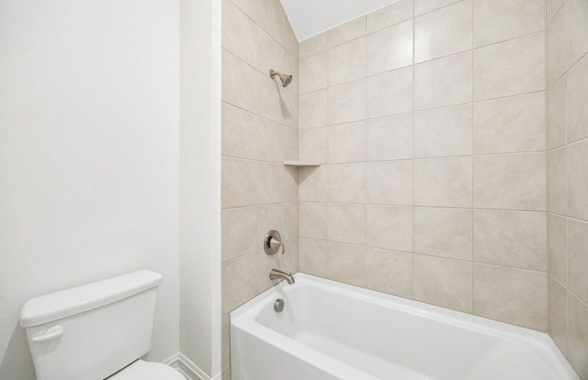 Secondary bath with tile surrounded shower