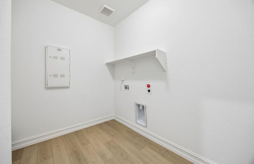 Laundry room with built-in shelving