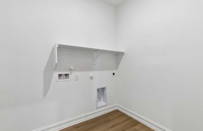 Laundry room with built-in shelving