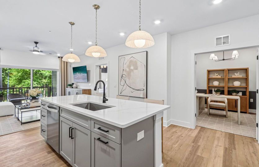 Gourmet Kitchen Overlooks Den and Gathering Room - Model Representation