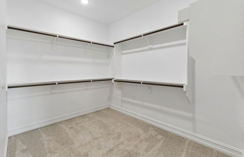 Spacious walk-in closet in owners suite